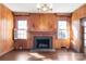 Spacious living room features wood walls, fireplace, and hardwood floors at 615 Peach St, Shelby, NC 28150