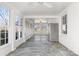 Sunroom with flagstone floor and large windows at 615 Peach St, Shelby, NC 28150