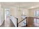 Spacious upper hallway with hardwood floors and chandelier at 615 Peach St, Shelby, NC 28150