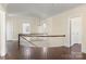 Bright upper hallway with hardwood floors and curved staircase at 615 Peach St, Shelby, NC 28150
