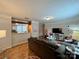 Spacious living room featuring a comfortable couch and wood floors at 5419 Stevens Mill Rd, Matthews, NC 28104
