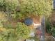 Aerial view of house and surrounding trees at 310 New Bern Ave, Statesville, NC 28677