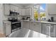 Modern kitchen with stainless steel appliances and island at 310 New Bern Ave, Statesville, NC 28677