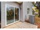 Rear exterior view showing sliding glass door and HVAC unit at 310 New Bern Ave, Statesville, NC 28677