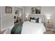 Comfortable bedroom with a queen bed, neutral decor, and a mirrored closet at 310 New Bern Ave, Statesville, NC 28677