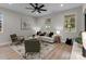 Bright living room with comfy seating and large windows at 310 New Bern Ave, Statesville, NC 28677