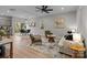 Open living room with a sofa, chairs, and ceiling fan at 310 New Bern Ave, Statesville, NC 28677