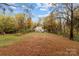 Large backyard with tree coverage at 310 New Bern Ave, Statesville, NC 28677