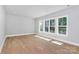 Bright bedroom with hardwood floors and multiple windows at 9911 Stacy Howie Rd, Waxhaw, NC 28173