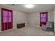 Relaxing bedroom with a comfortable recliner and dark red curtains at 1836 Westbrook Rd, Edgemoor, SC 29712