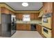 Retro kitchen with wood cabinets and appliances at 1836 Westbrook Rd, Edgemoor, SC 29712