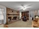 Living room with brick fireplace, built-in shelves, and comfy seating at 1836 Westbrook Rd, Edgemoor, SC 29712