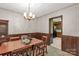Classic dining room with chandelier and kitchen view at 1836 Westbrook Rd, Edgemoor, SC 29712