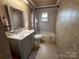 Updated bathroom with a vanity, toilet and bathtub at 3923 Old Pageland Monroe Rd, Monroe, NC 28112