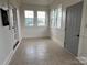 Sunroom with tile floor, multiple windows, and doors at 3923 Old Pageland Monroe Rd, Monroe, NC 28112