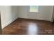Simple bedroom with hardwood floors and a window at 3923 Old Pageland Monroe Rd, Monroe, NC 28112
