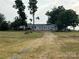 Ranch-style home with long driveway and mature trees at 3923 Old Pageland Monroe Rd, Monroe, NC 28112
