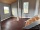 Spacious room with wood flooring, large windows, and a view of the stairs at 3923 Old Pageland Monroe Rd, Monroe, NC 28112