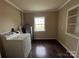 Laundry room with washer, dryer, window, and shelving at 3923 Old Pageland Monroe Rd, Monroe, NC 28112