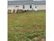 Large backyard with deck and grassy area at 501 Chestnut Grove Rd, Statesville, NC 28625