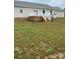 Large backyard with deck and grassy area at 501 Chestnut Grove Rd, Statesville, NC 28625