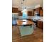 Modern kitchen featuring stainless steel appliances and a large island at 501 Chestnut Grove Rd, Statesville, NC 28625