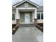 Front entrance with stone pillars and covered porch at 501 Chestnut Grove Rd, Statesville, NC 28625