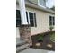 House exterior with stone column, landscaping, and shutters at 501 Chestnut Grove Rd, Statesville, NC 28625