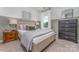 Well-lit bedroom with a queen bed and dresser at 1205 Red River Dr, Salisbury, NC 28144