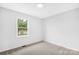 Simple bedroom with neutral walls and carpet flooring at 215 Bethesda Rd, Statesville, NC 28677