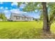 Ranch style home with a large yard and mature tree at 215 Bethesda Rd, Statesville, NC 28677