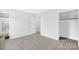 Bedroom with grey carpet, closet, and access to bathroom at 215 Bethesda Rd, Statesville, NC 28677