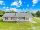 Ranch-style home with a spacious yard and detached garage at 215 Bethesda Rd, Statesville, NC 28677
