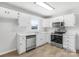 White kitchen with stainless steel appliances and ample counter space at 215 Bethesda Rd, Statesville, NC 28677