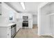 Clean kitchen, featuring white cabinets, stainless steel appliances, and vinyl flooring at 215 Bethesda Rd, Statesville, NC 28677