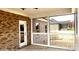 Screened porch with door and brick walls at 00 Wilson Ct # 15, Lincolnton, NC 28092