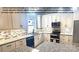 Bright white kitchen with granite countertops and tile backsplash at 00 Wilson Ct # 16, Lincolnton, NC 28092
