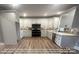 Kitchen with white cabinets, granite counters, and L-shaped design at 00 Wilson Ct # 16, Lincolnton, NC 28092