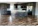 Modern kitchen features dark gray cabinets, granite counters, and wood-look floors at 00 Wilson Ct # 16, Lincolnton, NC 28092