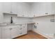 Bright laundry room with white cabinets and a large countertop at 4013 Nettie Ct # 6, Charlotte, NC 28211