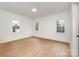 Spacious bedroom with hardwood floors and multiple windows at 4013 Nettie Ct # 6, Charlotte, NC 28211