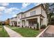 Two-story home with brick facade, covered porch, and landscaped lawn at 4013 Nettie Ct # 6, Charlotte, NC 28211