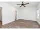 Bright bedroom with wood-look flooring and ceiling fan at 1975 Ripplerock Rd, Fort Mill, SC 29715