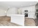 Modern white kitchen with stainless steel appliances and island at 1975 Ripplerock Rd, Fort Mill, SC 29715