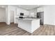 Kitchen featuring white cabinets, granite countertops, stainless steel appliances, and a pantry at 1977 Ripplerock Rd, Fort Mill, SC 29715