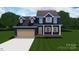 Two-story home with navy siding, cedar wood accents, and a brown garage door at 1981 Ripplerock Rd, Fort Mill, SC 29715