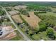 Aerial view of land lot near road and trees at 112 W Highway 218 Rd, Monroe, NC 28110