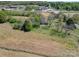 Aerial view of house and land, near a road at 112 W Highway 218 Rd, Monroe, NC 28110