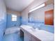 Bathroom with light blue tile and a bathtub at 112 W Highway 218 Rd, Monroe, NC 28110