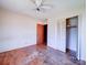 Hardwood floors, ceiling fan, and closet with bi-fold doors at 112 W Highway 218 Rd, Monroe, NC 28110